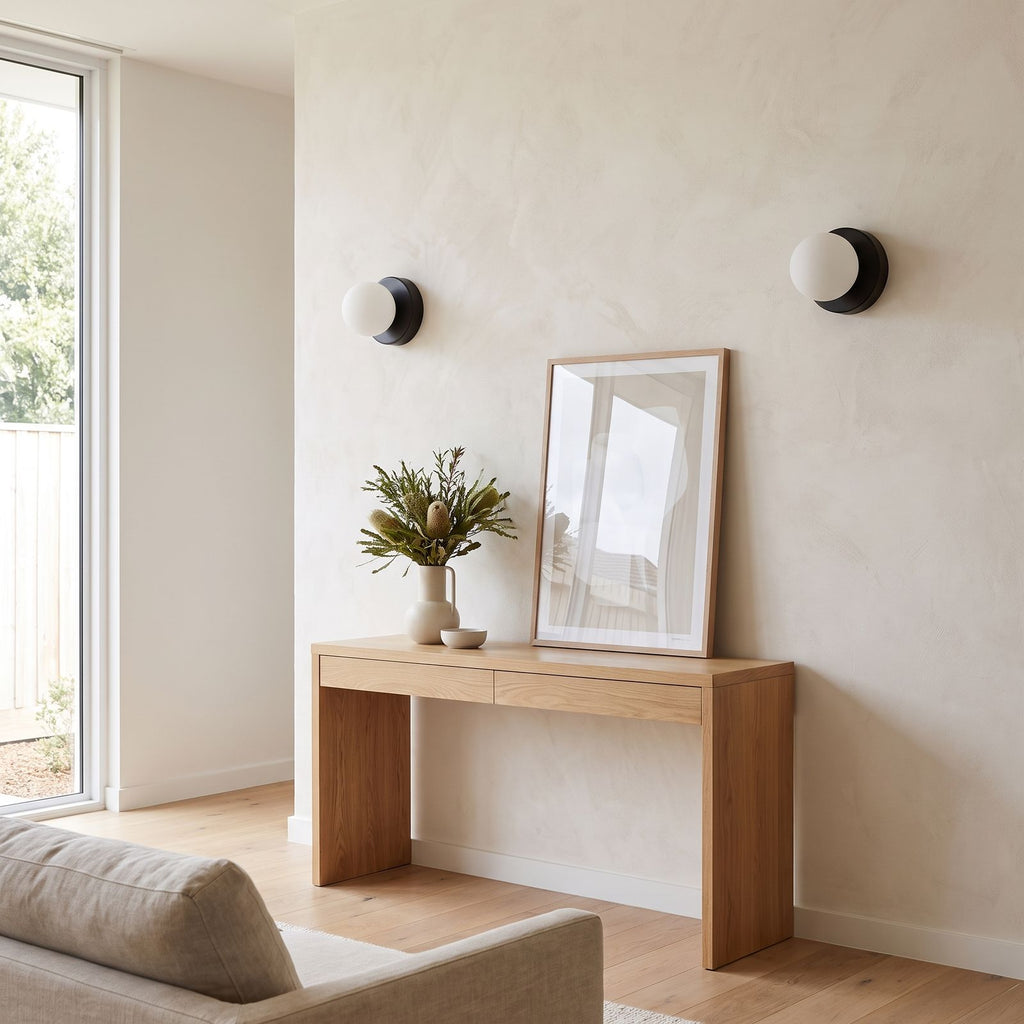 Compact Rounded Glass and Iron Wall Light in a pair on a wall of an Australian home