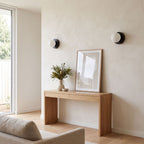Compact Rounded Glass and Iron Wall Light in a pair on a wall of an Australian home
