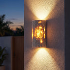 Compact Yellow Travertine Up Down Outdoor Wall Light on a porch wall at dusk