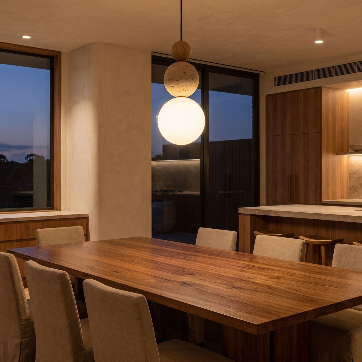 Cream Stone Ball Bedside Pendant Light above a timber dining table