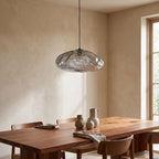 Crumpled Glass Cloud Pendant Light above a timber dining table