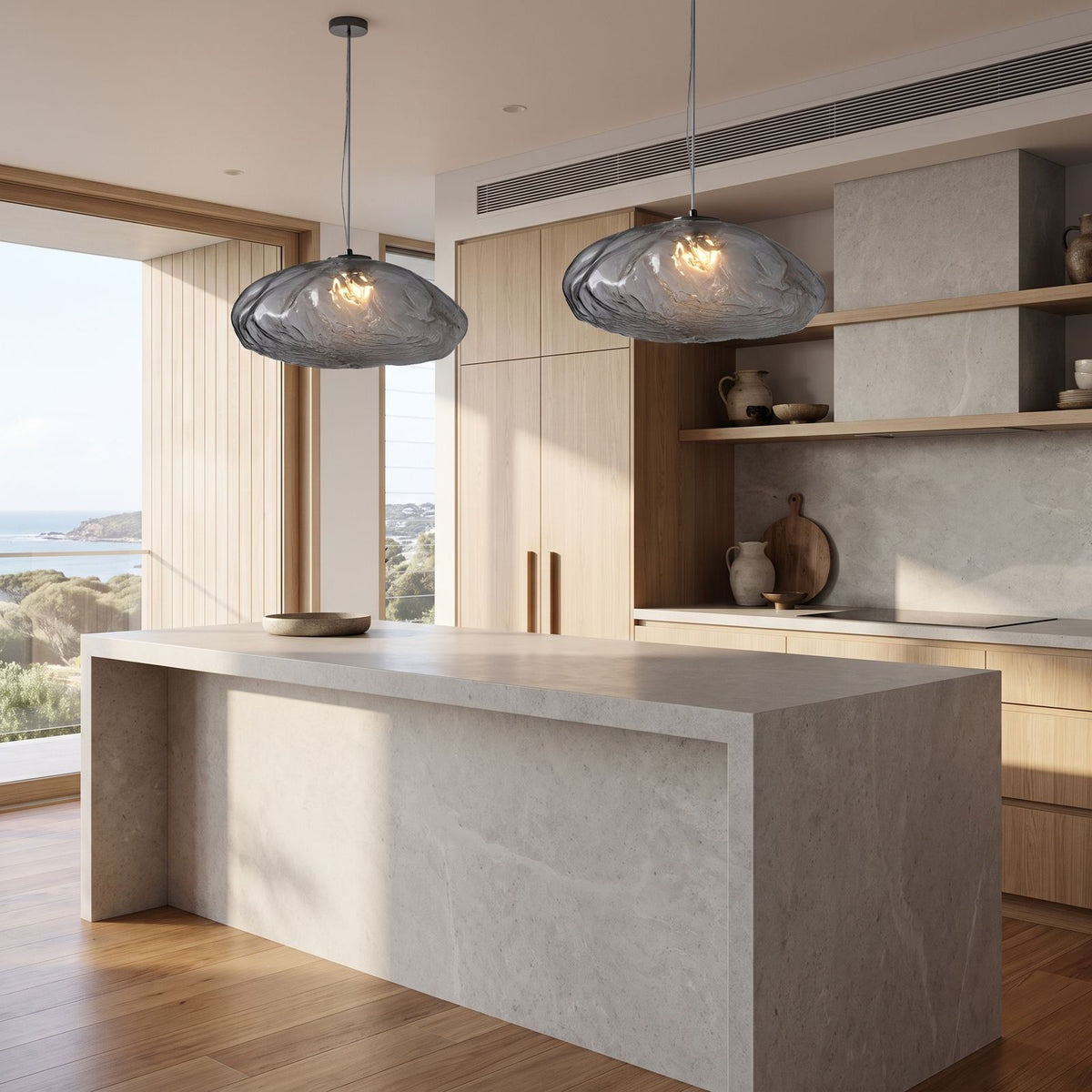 Crumpled Glass Cloud Pendant Light in a pair over a stone kitchen island