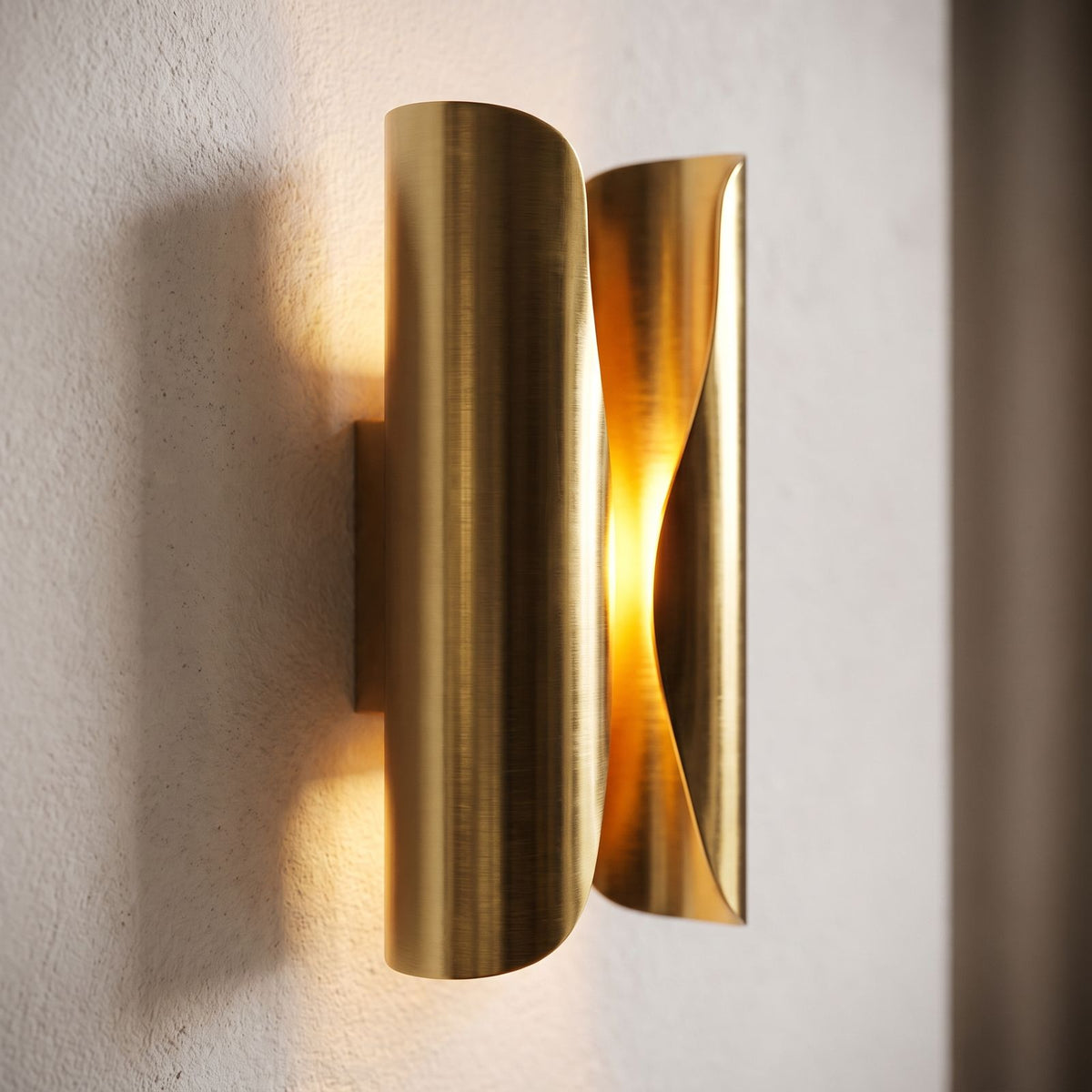 Curled Brass Panel Wall Sconce, close view at 45 degrees on a plaster wall