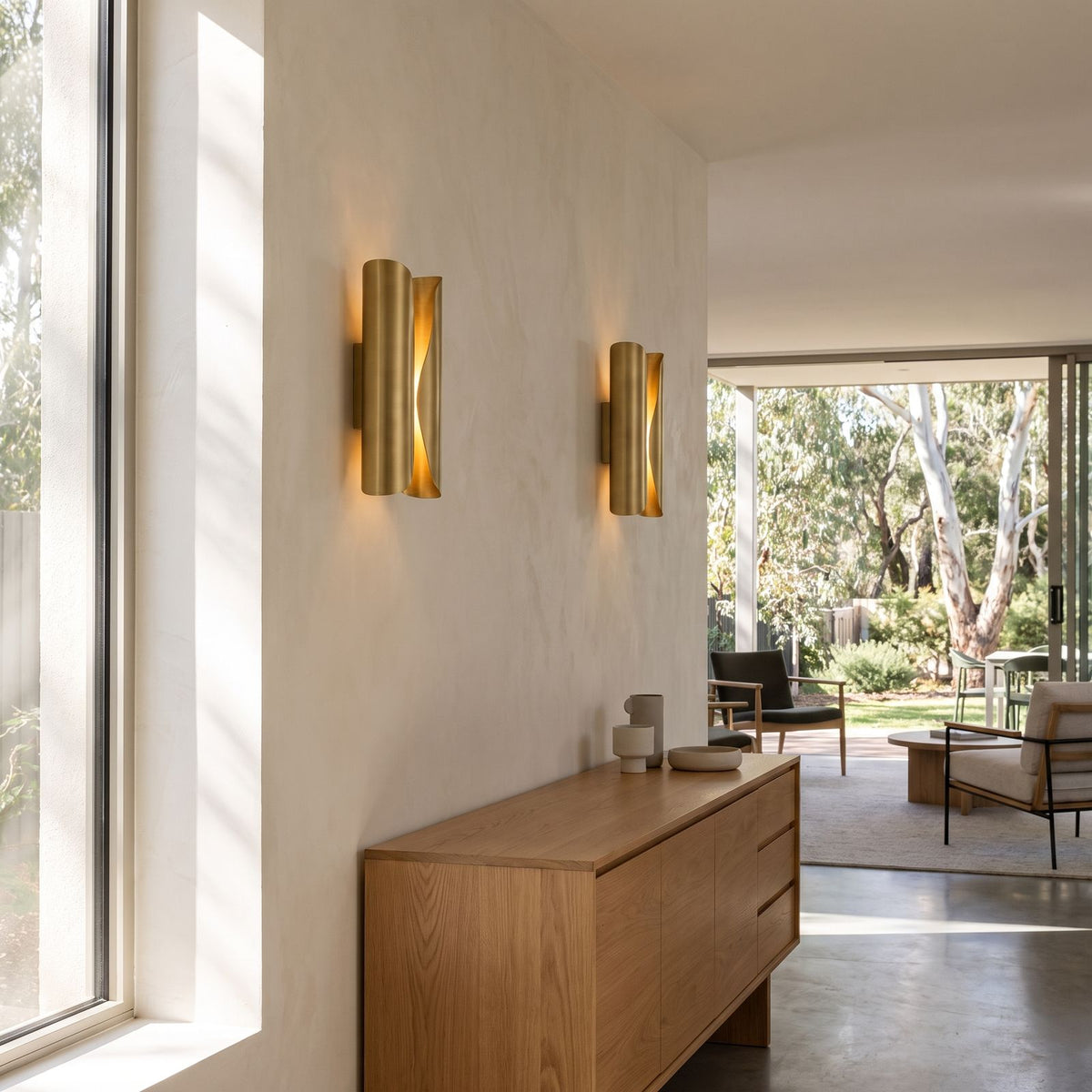 Curled Brass Panel Wall Sconce in a pair on a wall of an Australian home