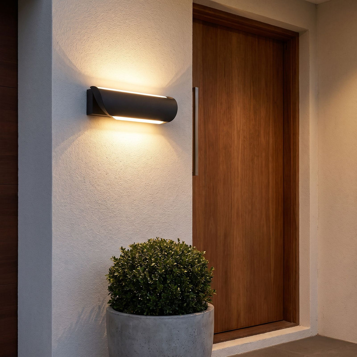 Curved Acrylic LED Outdoor Wall Light beside a timber front door on a rendered wall