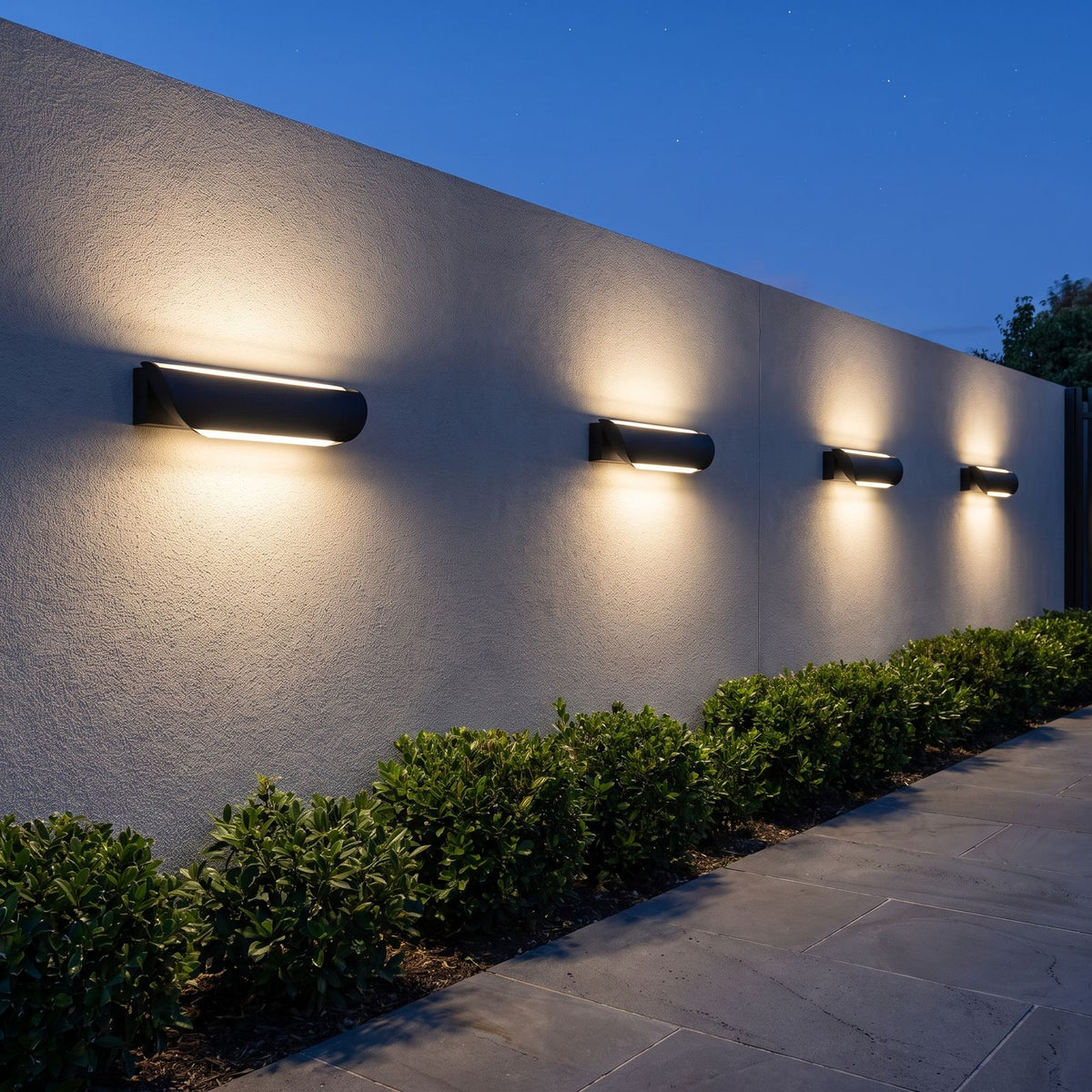 A row of Curved Acrylic LED Outdoor Wall Lights along a rendered boundary wall at dusk