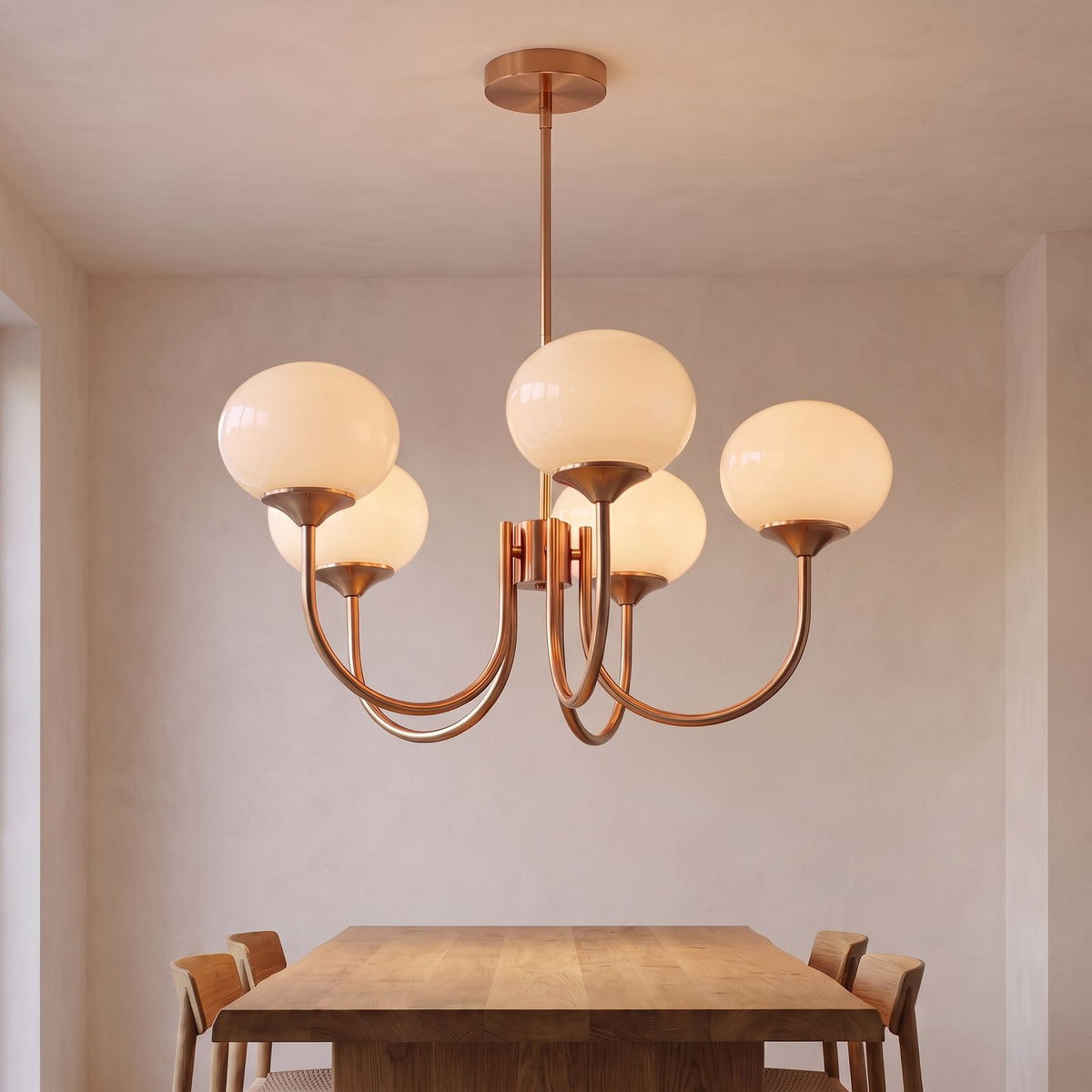 Curved Arm Opal Glass Mushroom Globe Pendant Light with cream globes above a dining table