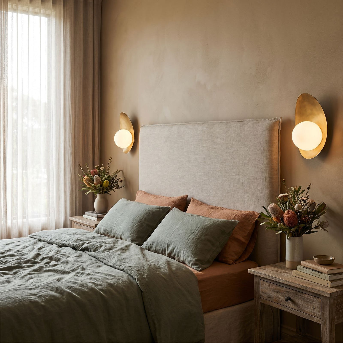 Curved Gold Shield Opal Globe Wall Light in a pair on a wall of an Australian home