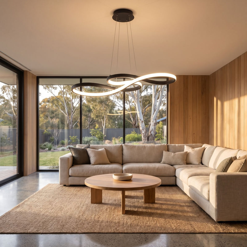 Curved ribbon aluminium LED pendant light in a wide living room view