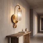 Diagonal Fluted Glass Cylinder Wall Light in a hallway above a timber console