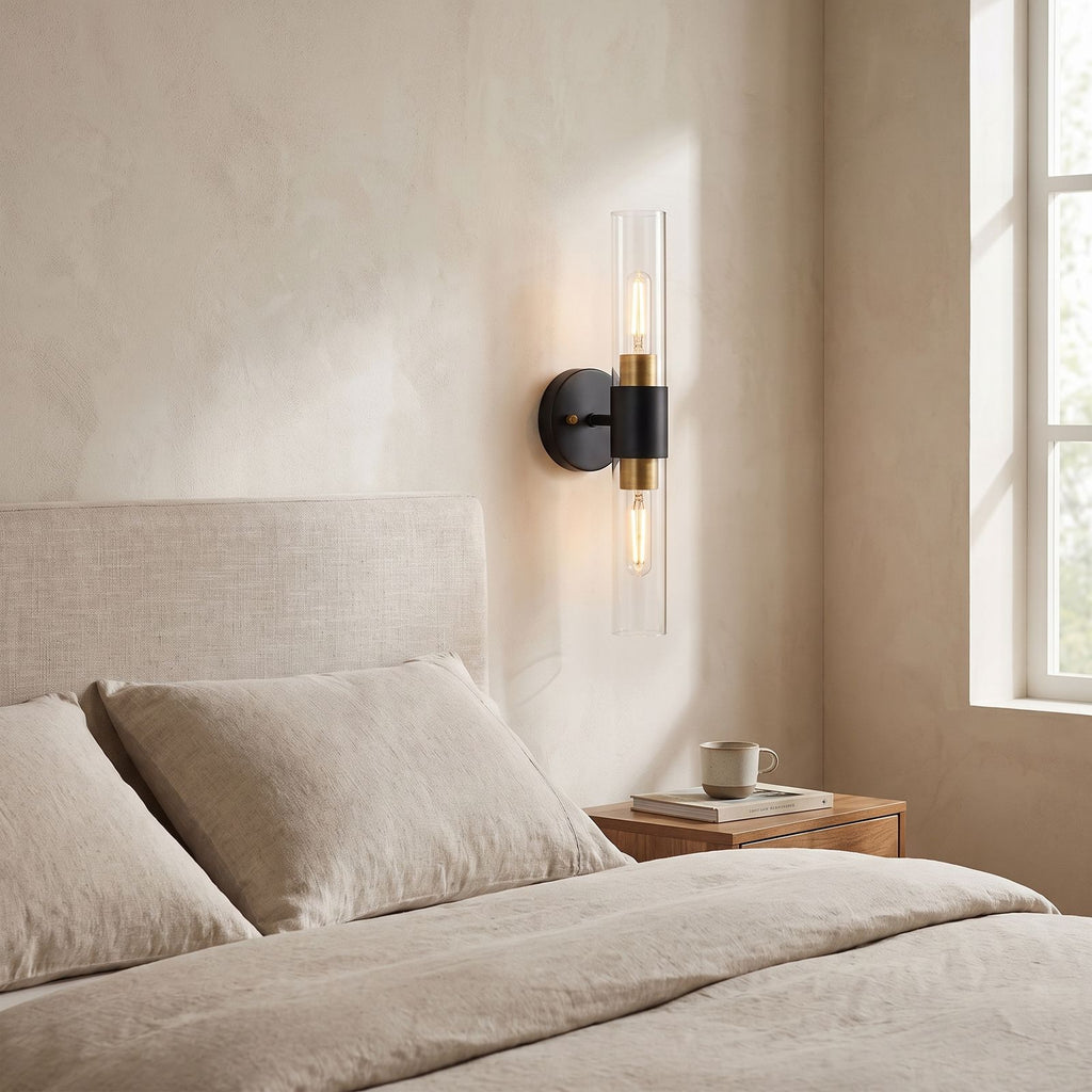 Double Bulb Clear Glass Tube Wall Light on a bedroom wall beside the bed