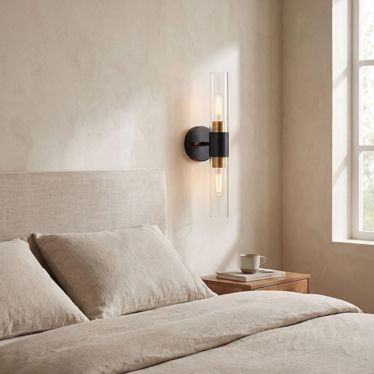 Double Bulb Clear Glass Tube Wall Light on a bedroom wall beside the bed