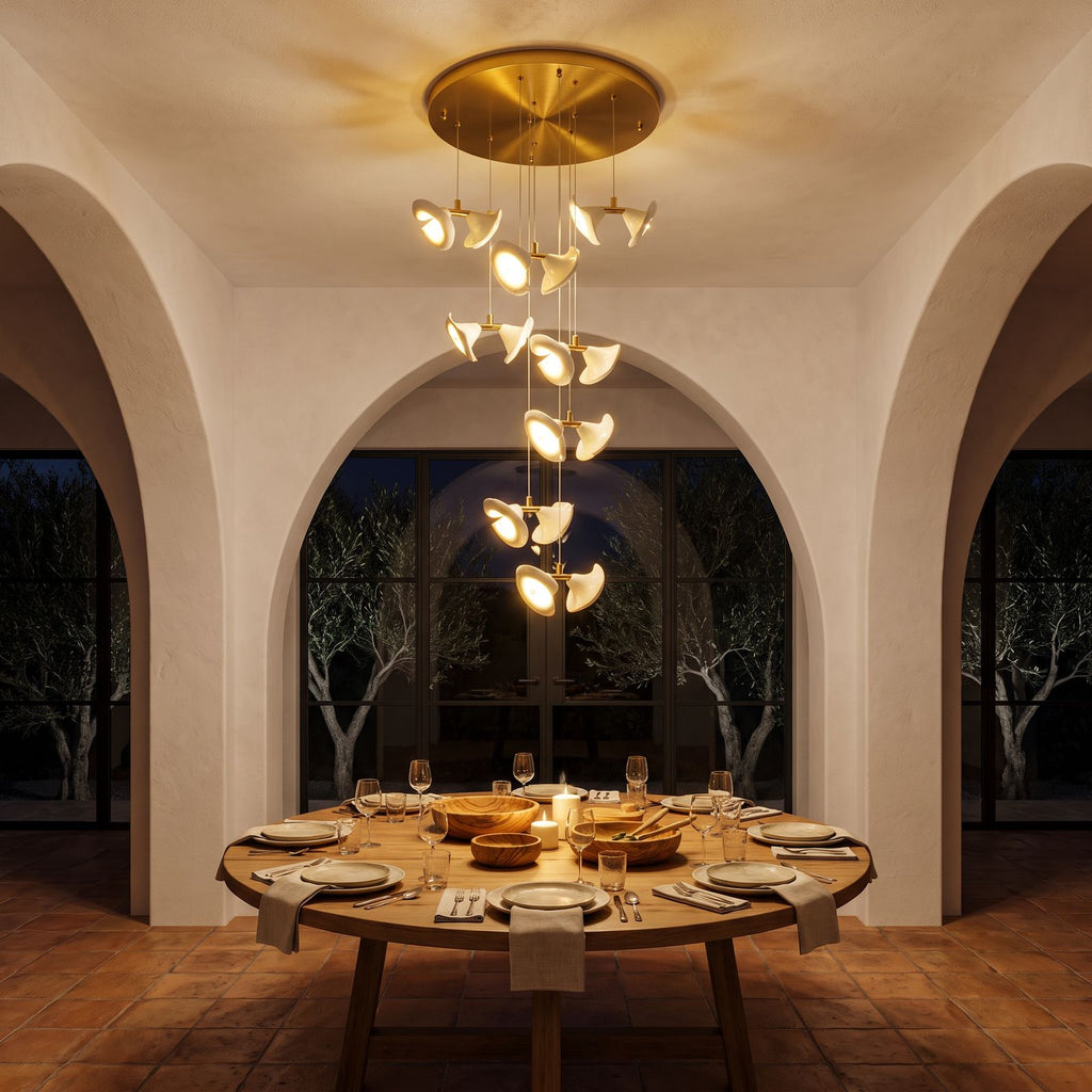 Double Ceramic Trumpet Cluster Chandelier above a round dining table at night