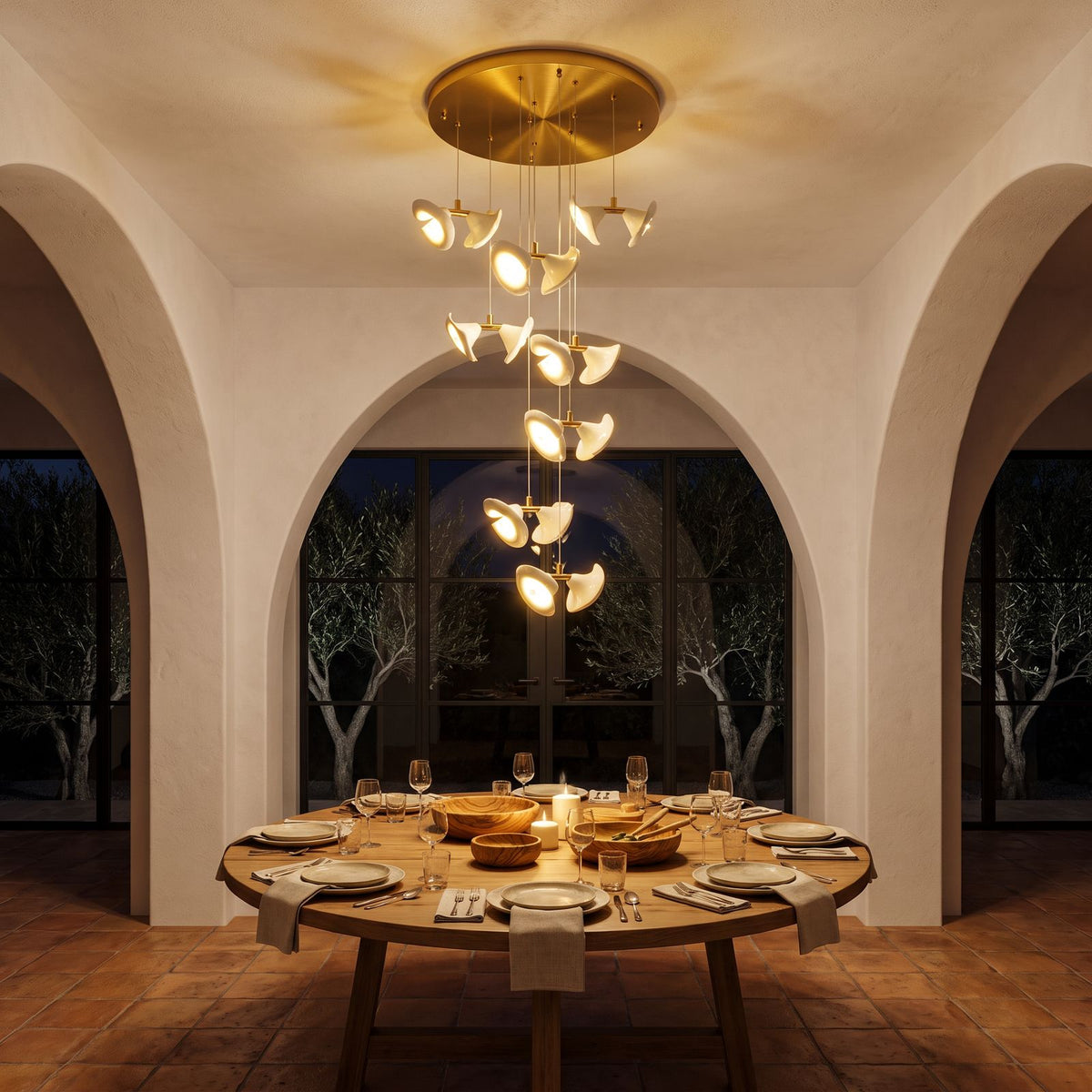 Double Ceramic Trumpet Cluster Chandelier above a round dining table at night