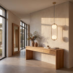 Double glass globe oval hoop pendant light in a wide entry hall view