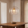 Double Glass Fluted Dome Pendant Light above a dining table