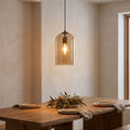 Double Layer Tinted Glass Bell Pendant Light above a dining table
