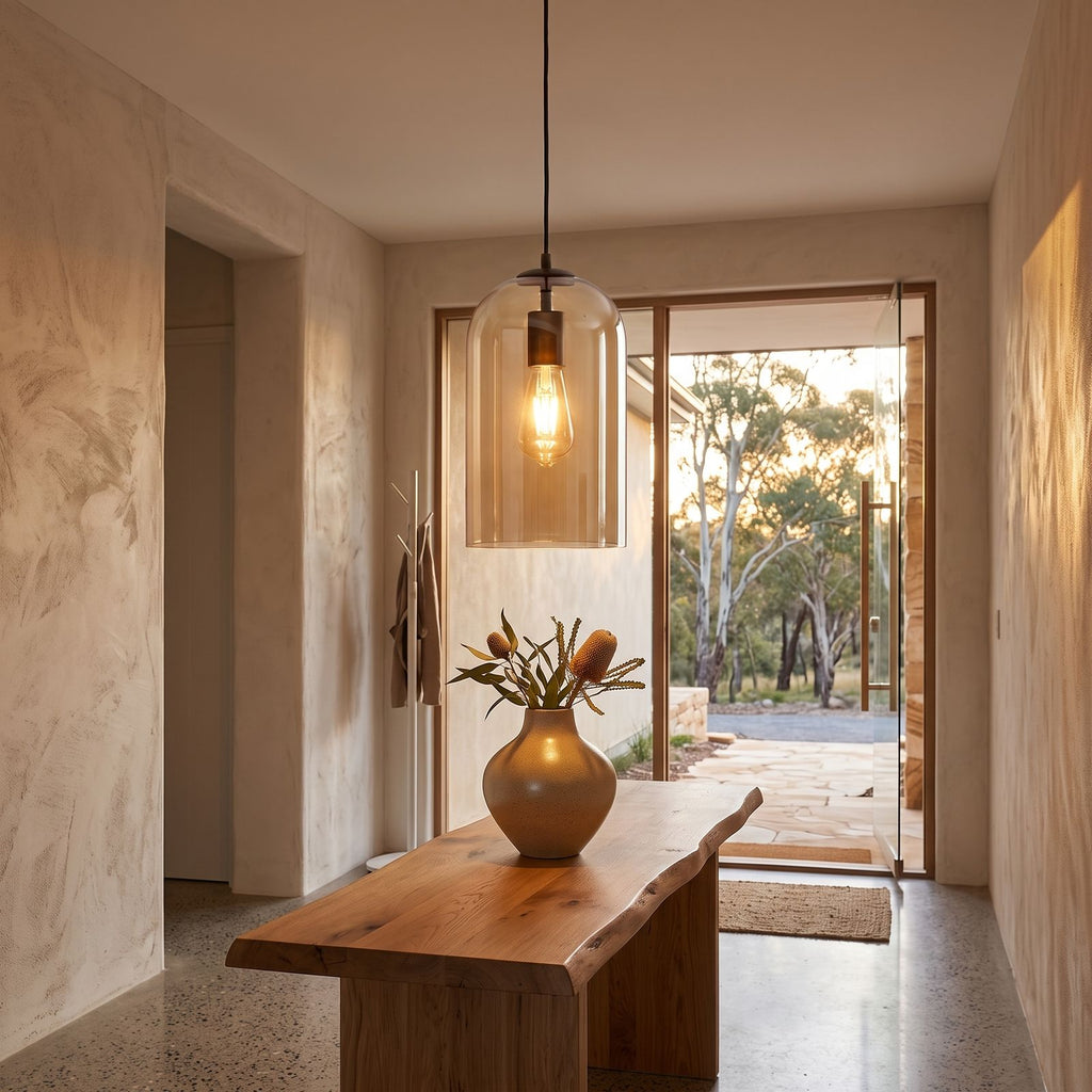 Double layer tinted glass bell pendant light in a wide entry hall view