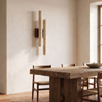 Double Travertine Column Wall Light on a dining room wall