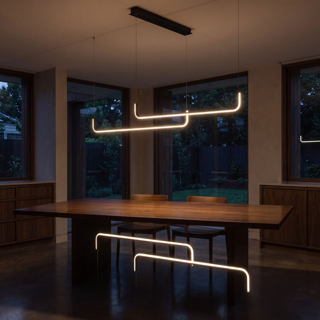 Double U-bar linear LED pendant light over a dining table at night