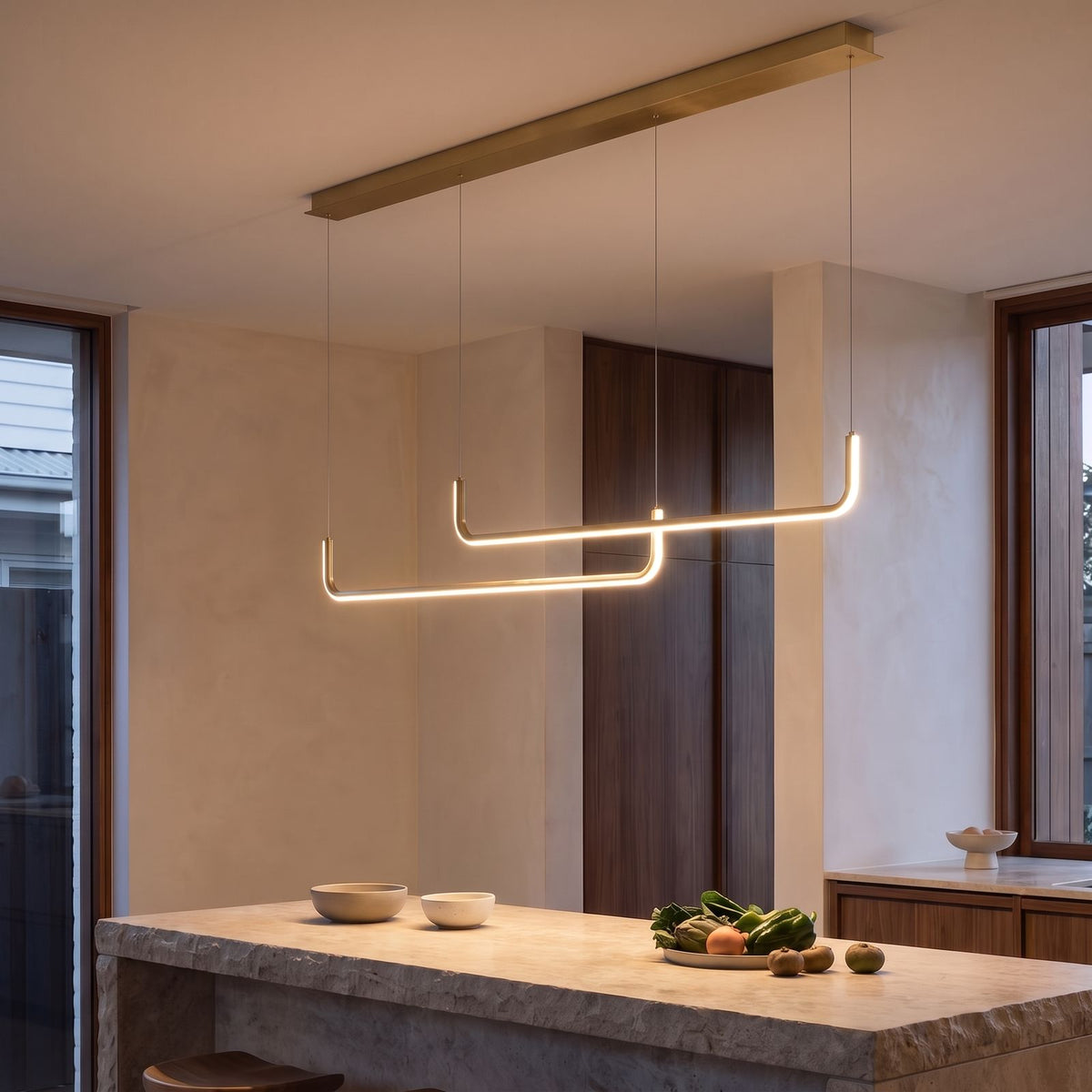 Double U-Bar Linear LED Kitchen Island Pendant Light in gold over a kitchen island