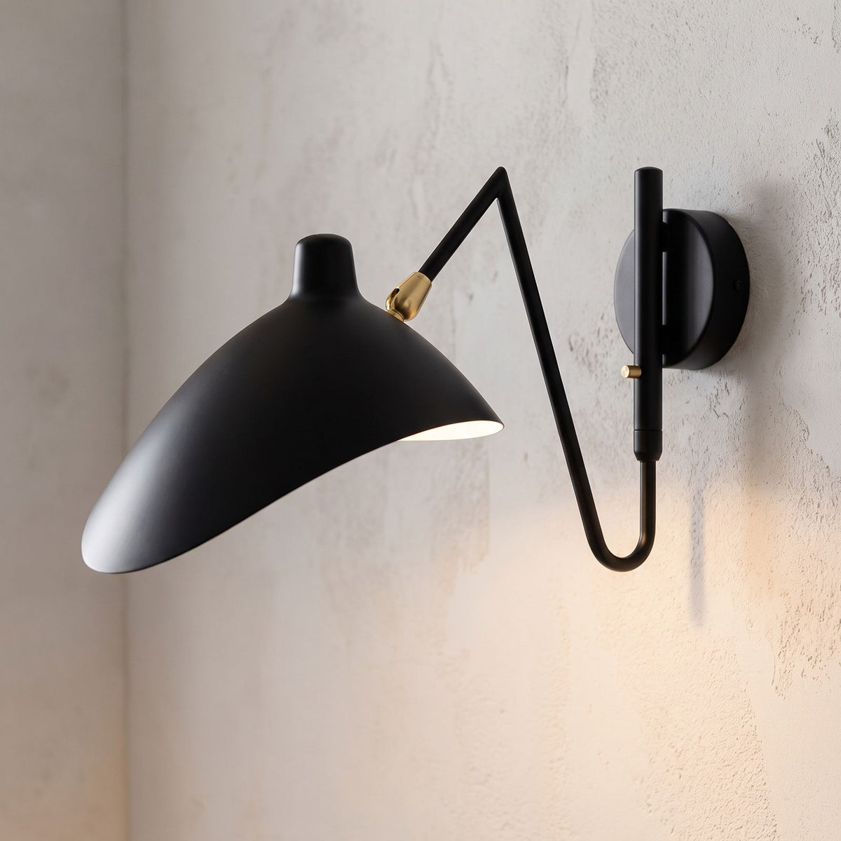 Duckbill Shade Adjustable Arm Wall Light, close view at 45 degrees on a plaster wall