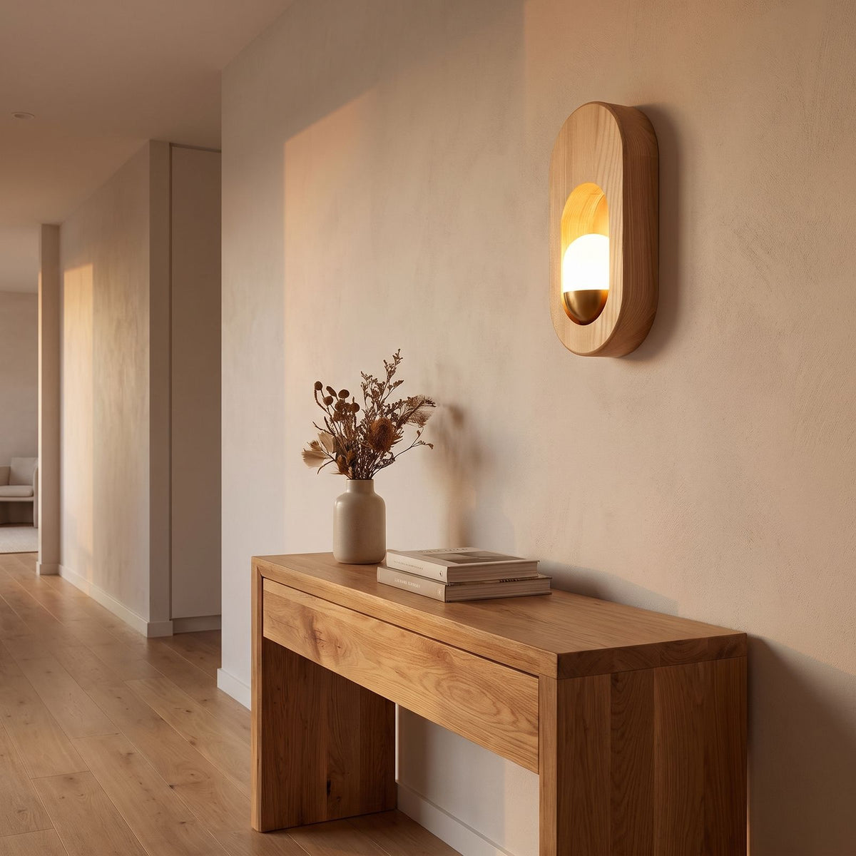 Egg-Shaped Wood and Acrylic Wall Light in a hallway above a timber console