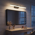 Extendable Dual Rod Stainless Steel LED Vanity Wall Light above the mirror of a makeup table at night