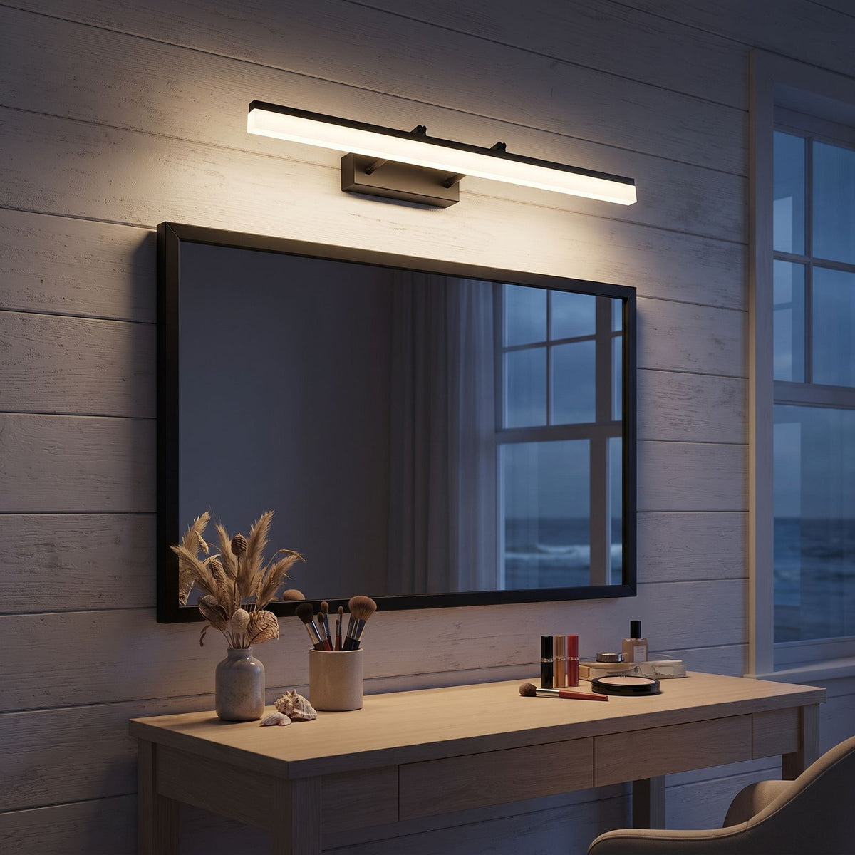 Extendable Dual Rod Stainless Steel LED Vanity Wall Light above the mirror of a makeup table at night