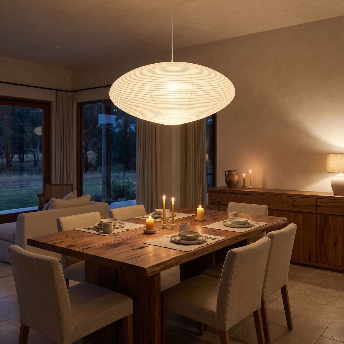 Faceted Mulberry Paper Pendant Light above a timber dining table