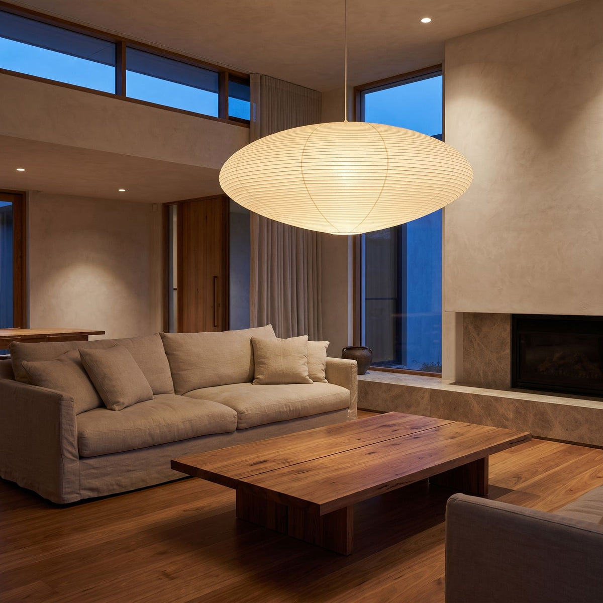 Faceted Mulberry Paper Pendant Light above a linen sofa in a living room