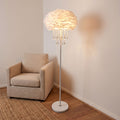 Feather Shade Crystal Drop LED Floor Lamp beside an armchair in a living room corner