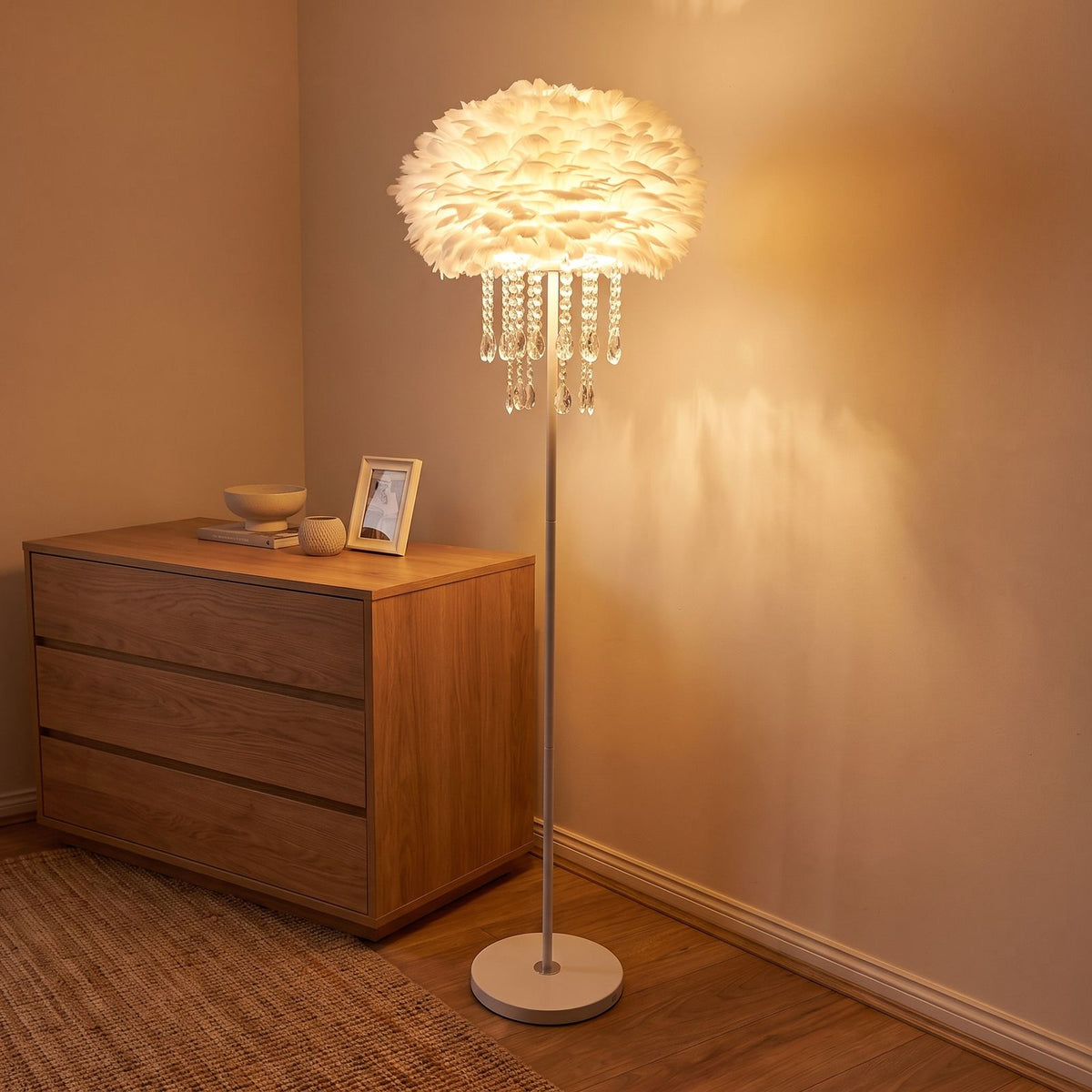 Feather shade crystal drop floor lamp in a bedroom corner beside a dresser
