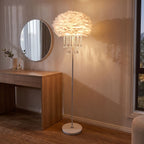 Feather shade crystal drop floor lamp beside a dressing table in a bedroom