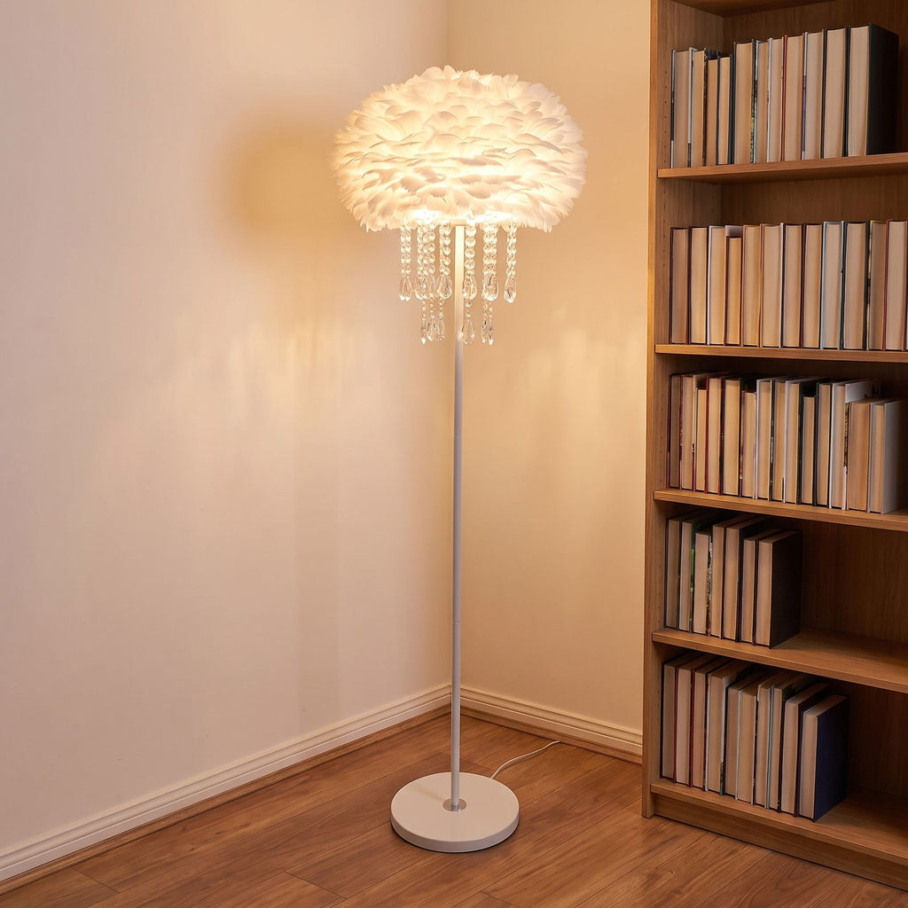 Feather shade crystal drop floor lamp in a reading corner beside a bookshelf