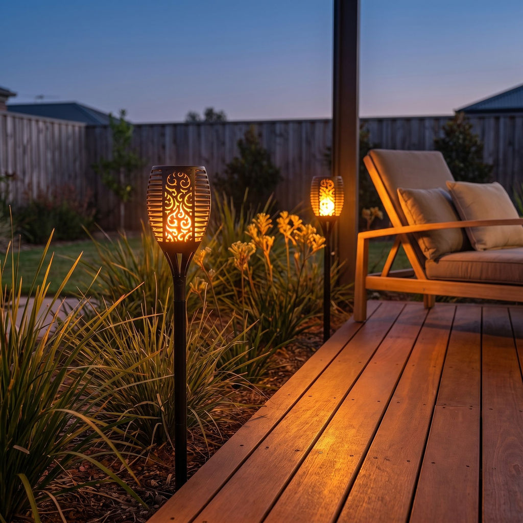 Flame effect solar garden torch beside a timber deck