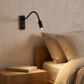Flexible Gooseneck LED Bedside Reading Wall Light beside a bed