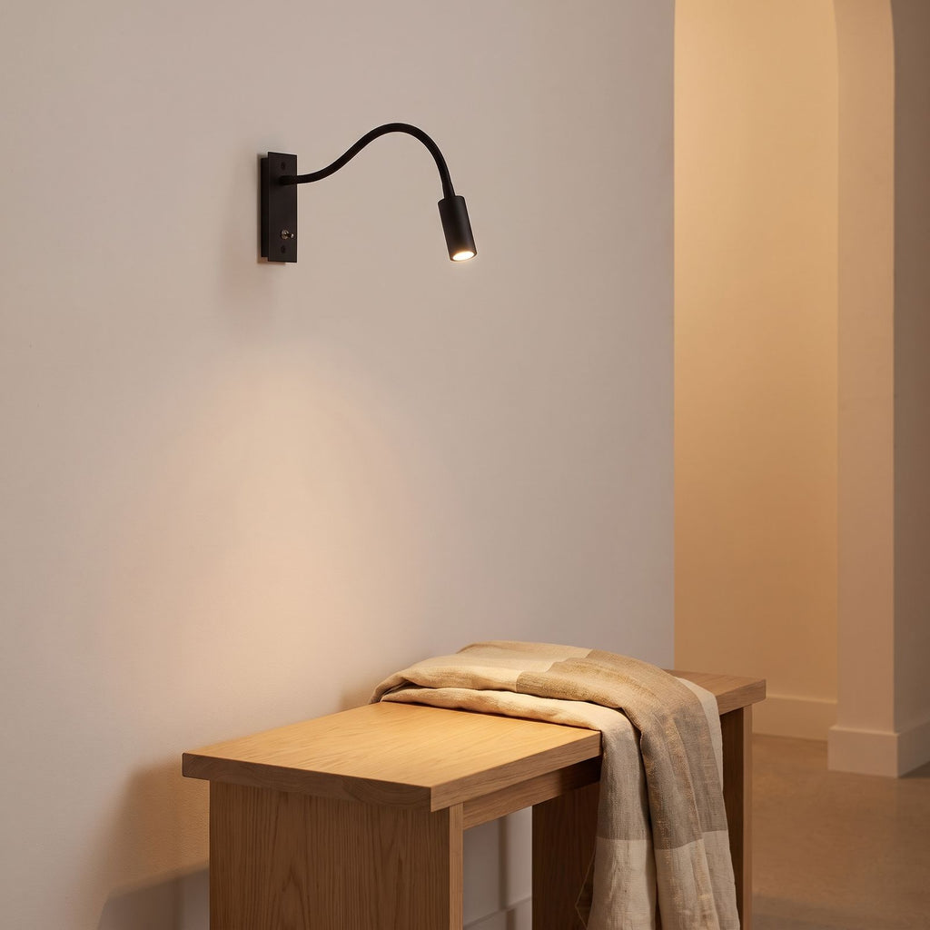 Flexible gooseneck reading wall light on a timber bedhead wall
