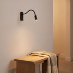 Flexible gooseneck reading wall light on a timber bedhead wall