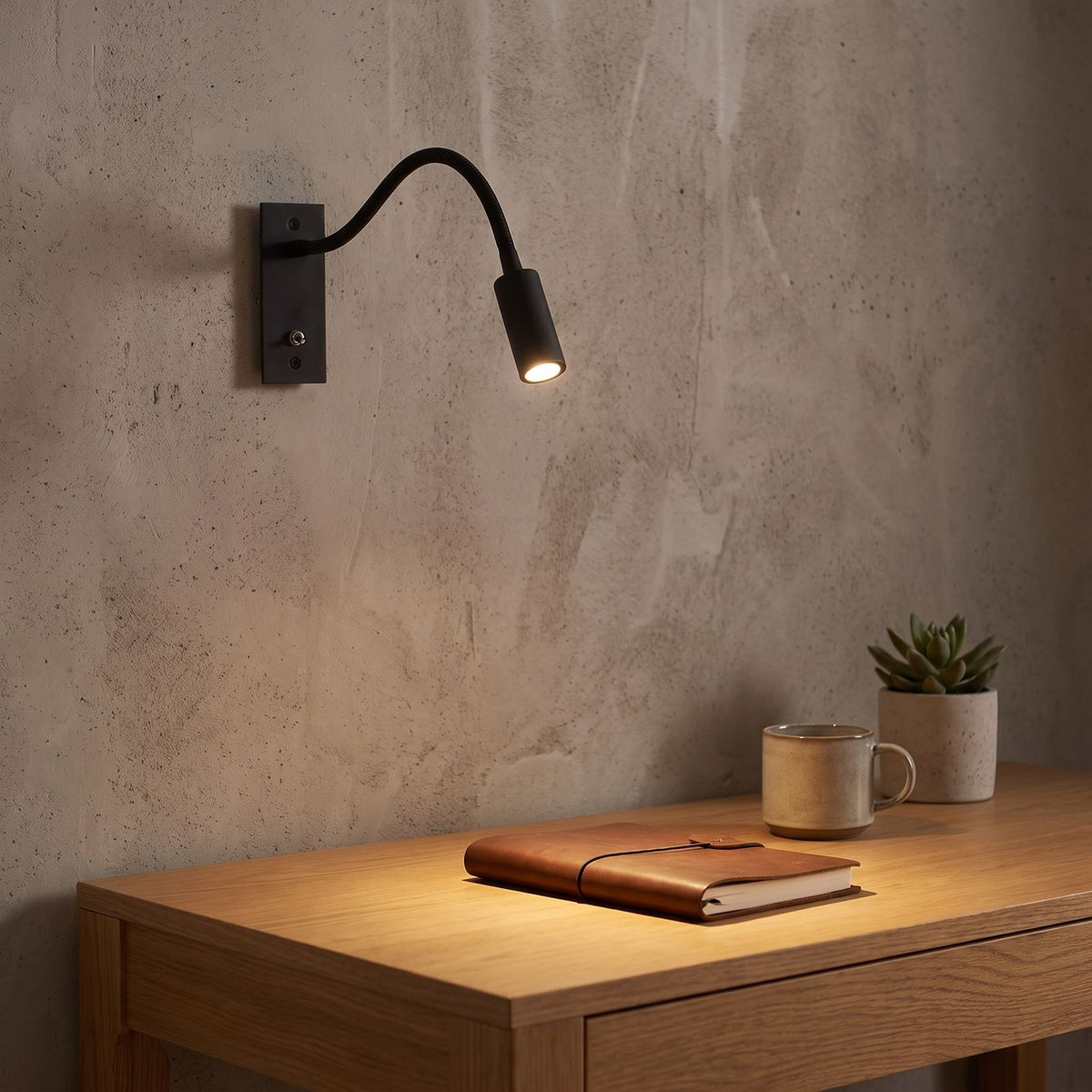 Flexible gooseneck reading wall light above a home office desk