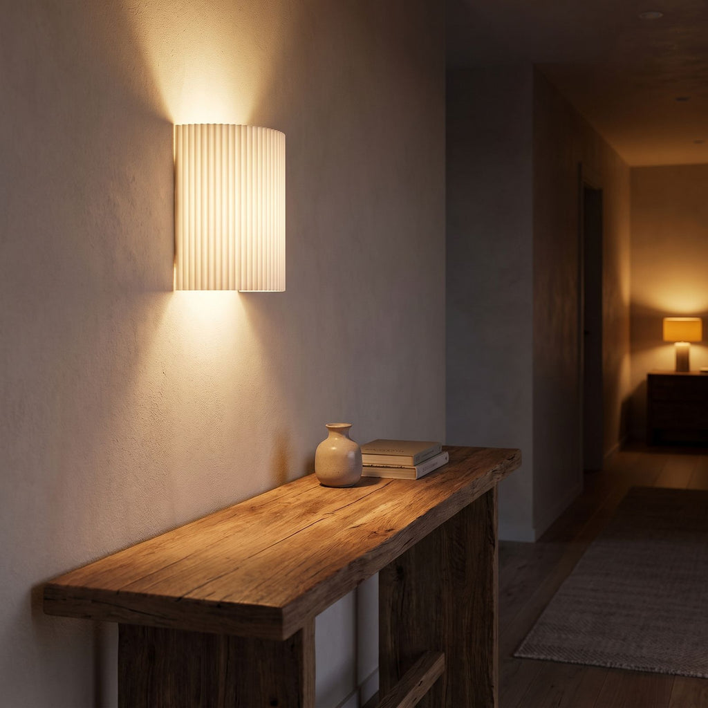 Fluted Resin Wall Light in a hallway above a timber console