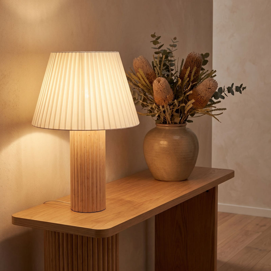 Fluted wood pleated shade table lamp on an entry console