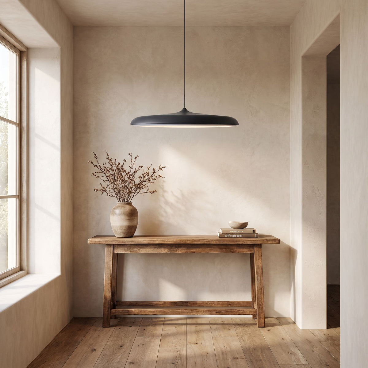 Flying Saucer LED Pendant Light above a console in an entry hallway