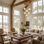 Folded Ceramic Petal Cluster Chandelier in a double-height living room in daylight