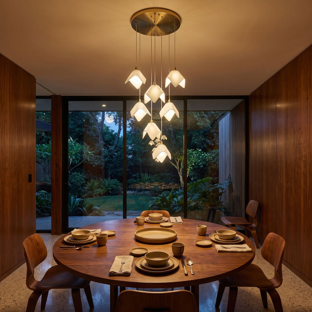 Folded Ceramic Petal Cluster Chandelier above a round dining table at night