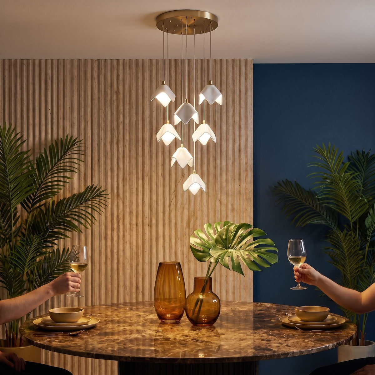 Ceramic Petal Cluster Pendant Light in neutral white above a round marble dining table