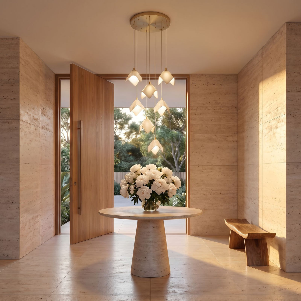 Ceramic Petal Cluster Pendant Light above a round travertine table in an entry hall