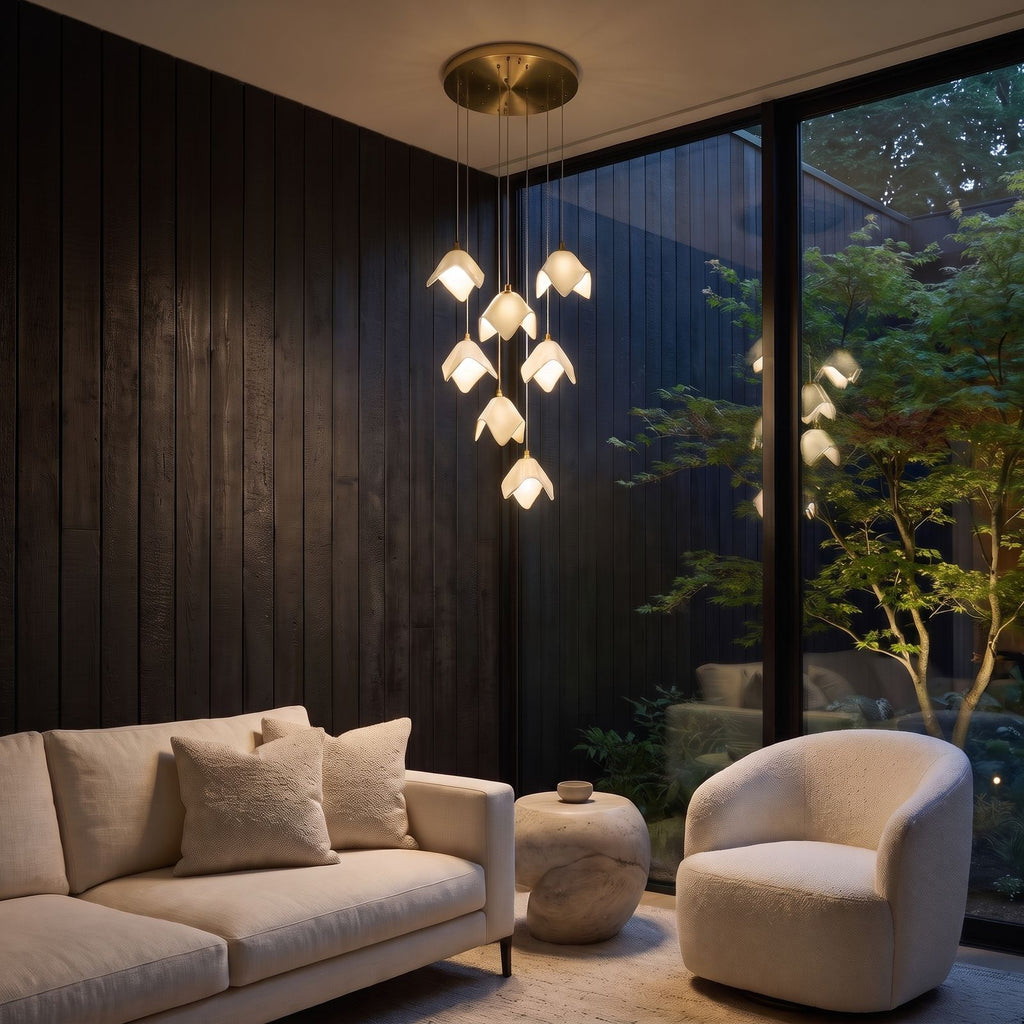 Ceramic Petal Cluster Pendant Light above a reading chair in a living room with charred timber walls at night
