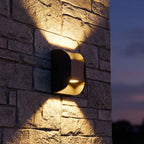 Forged Metal Mini Up Down Outdoor Wall Light on a porch wall at dusk