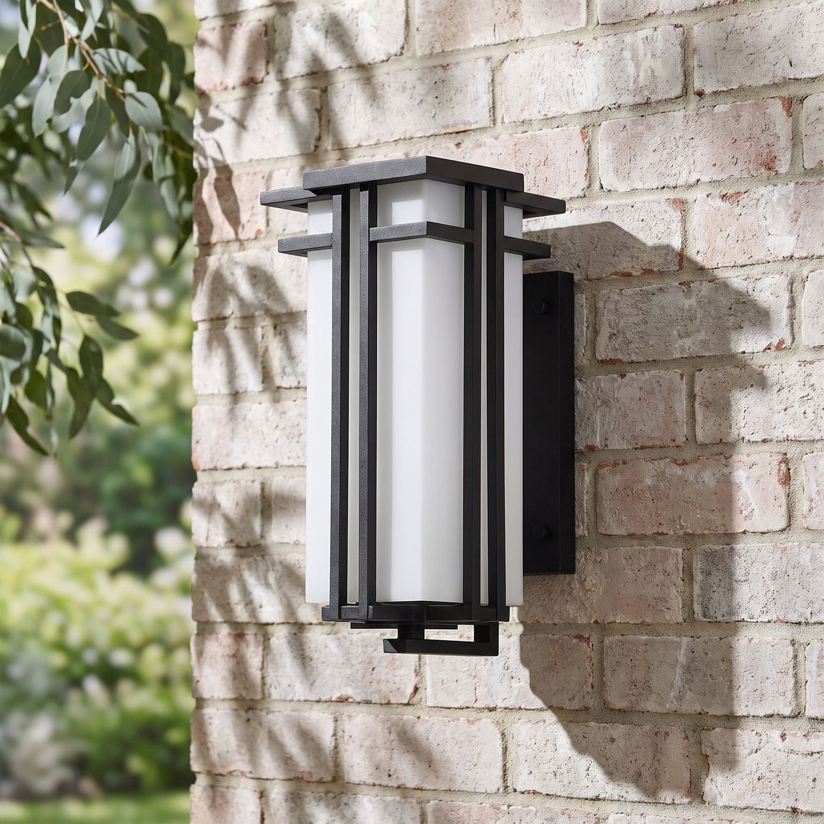 Frosted Glass Prairie Outdoor Wall Lantern on a brick wall, angled close view